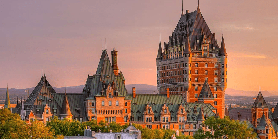 Exterior aerial view of Chateau Frontenac at sunset in Quebec City