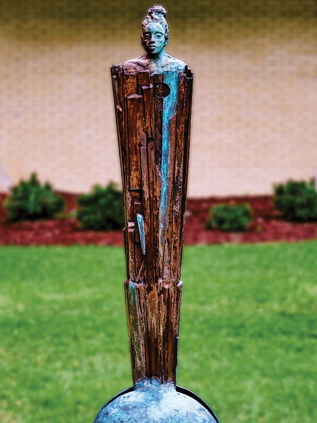 Painted aluminum statue of woman
